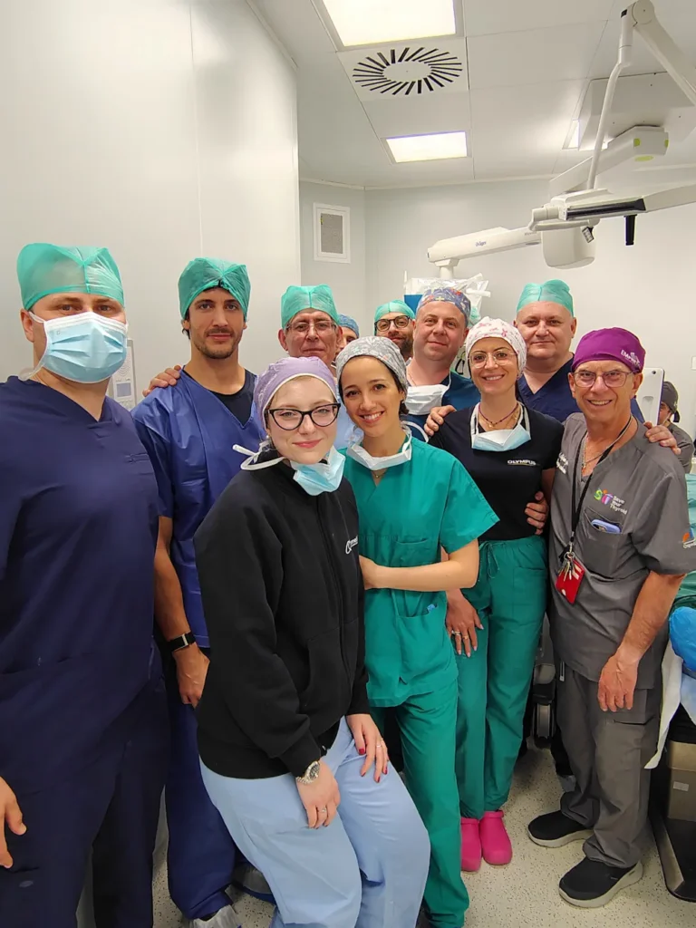 Group photo of doctors in an operating room. Specialists from Ukraine and Italy are present.